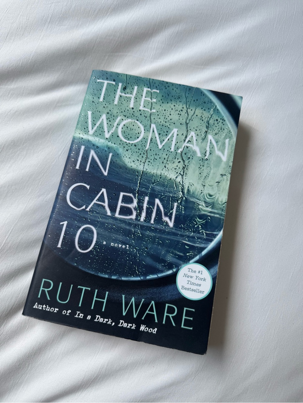 The Woman in Cabin 10 by Ruth Ware - Teal & Black Paperback